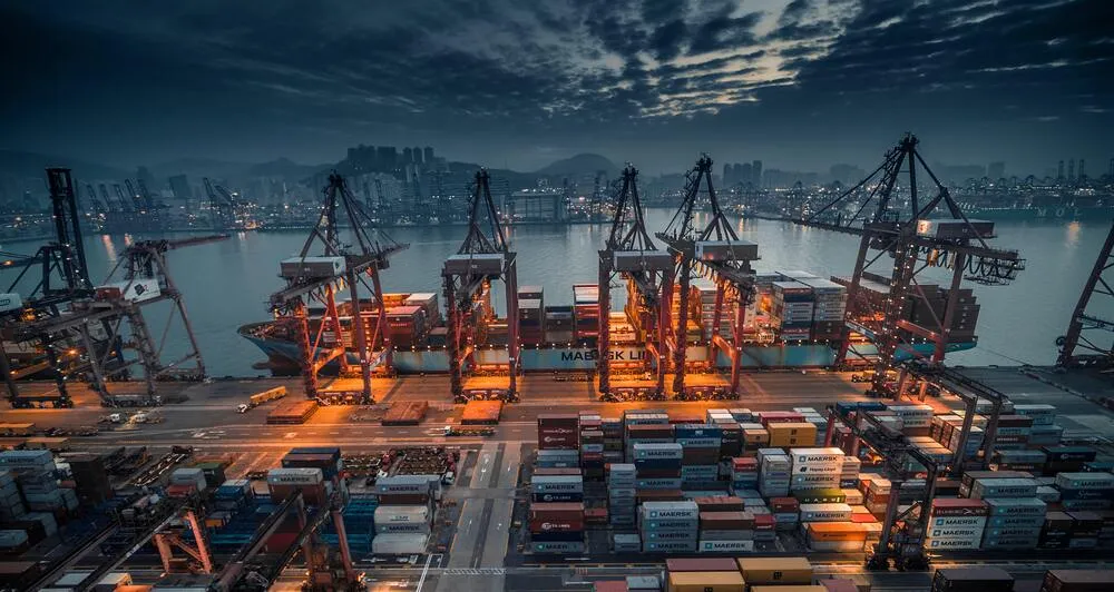 Container vessel unloading at port in Hong Kong